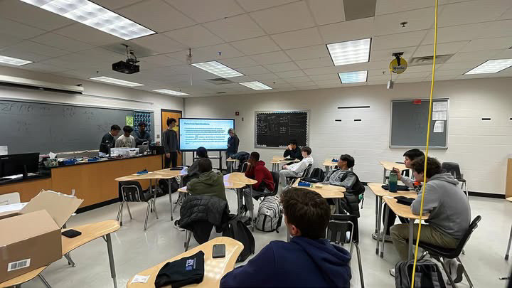 Team presenting rocket designs